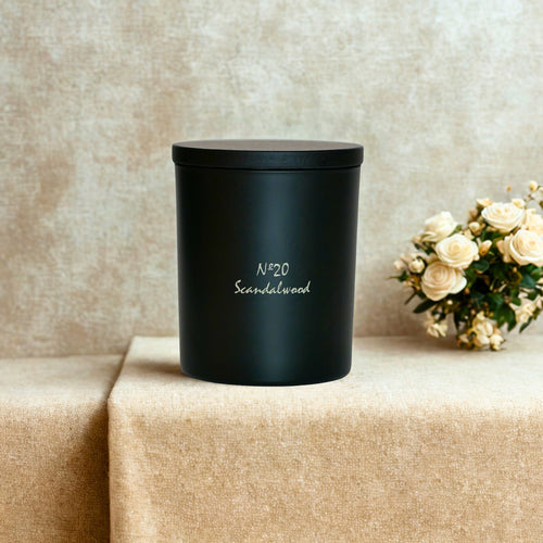 Scandalwood signature candle by Chiije, front view on a neutral surface