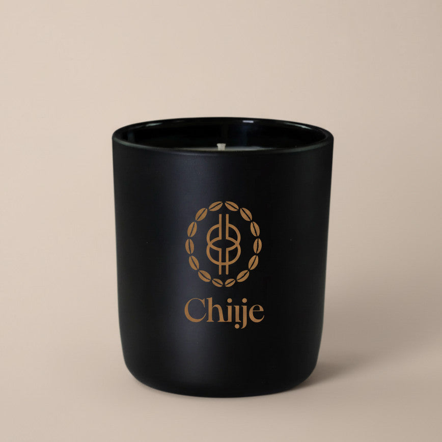 Hand-poured natural wax candle in jar with smoky musk and amber undertones.