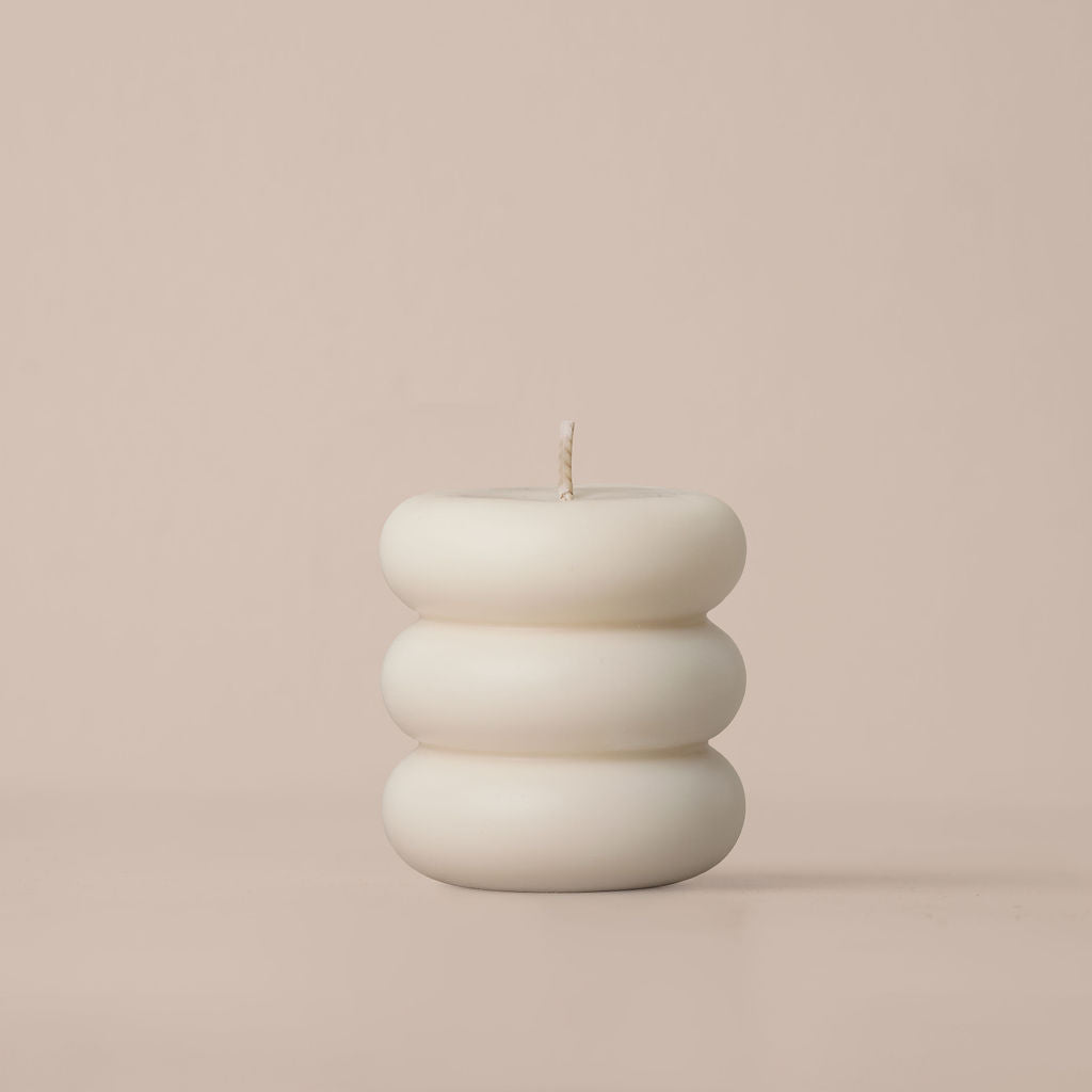 Close-up of the Nordic Becoming 020 candle showing its organic form.