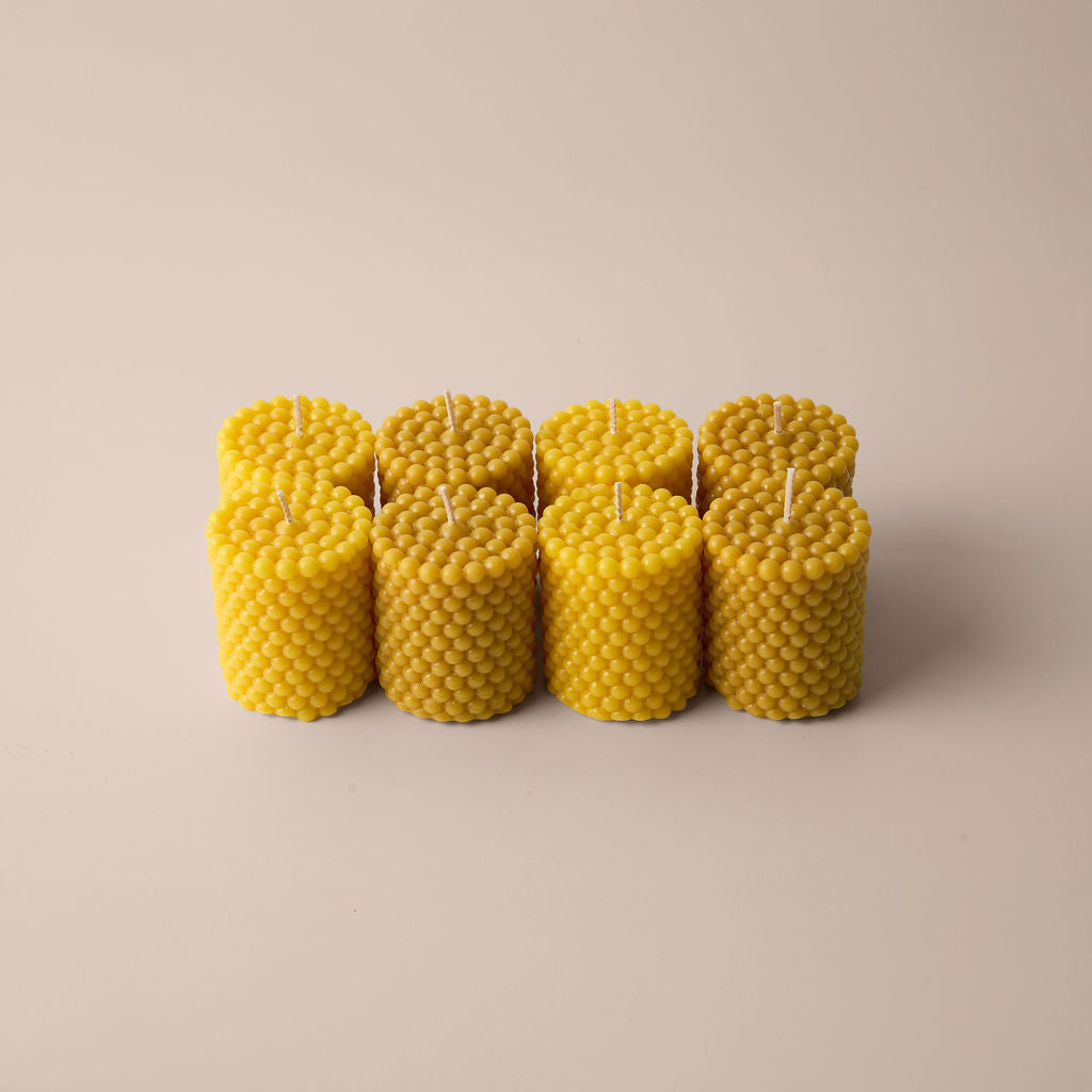 Handcrafted beeswax sculpted candles inspired by Norwegian fjords.