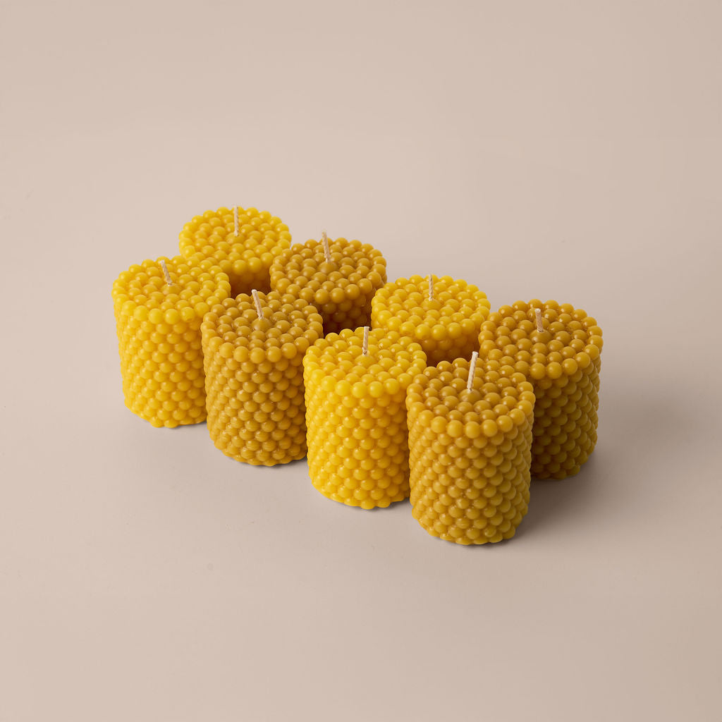 Chiije Nordic Fjord 008 beeswax pillar candle on a neutral surface.